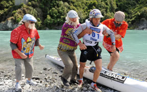 Steve Gurney, Team The Flying Whio's is helped out of the kayak from the Juddies support crew., Speight's Coast to Coast, Gorge Bridge. .Friday February 11, 2011..Photo: Mark Tantrum/photosport.co.nz