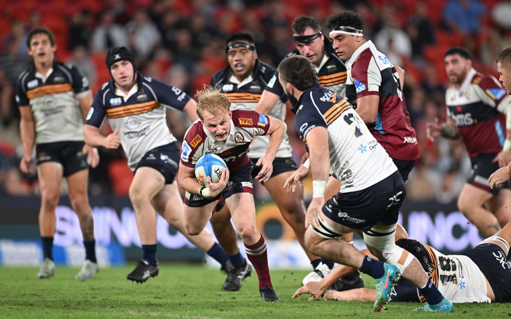 Tom Lynagh attacks for the Reds against the ACT Brumbies in a Super Rugby Pacific match at Suncorp Stadium, Brisbane, 12 April, 2025.