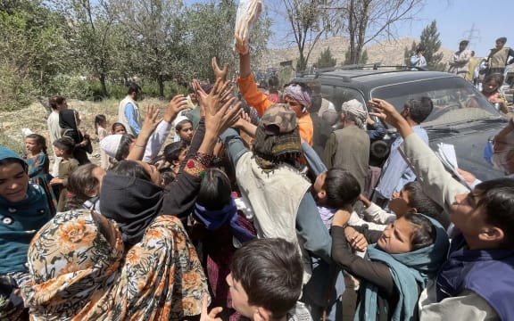 Displaced Afghan families flee northern provinces due to clashes between Taliban and Afghan security as they seek refuge inside a park with harsh conditions in Kabul, Afghanistan, on August 10, 2021.