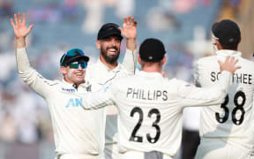 Tom Latham (c) of New Zealand and Daryl Mitchell of New Zealand celebrate.
