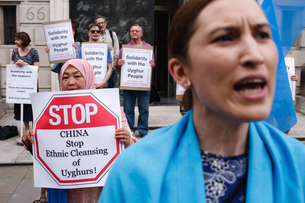 Members and supporters of the Uighur community in the UK mark the 10th anniversary of the 2009 Urumqi riots at a rally outside the Chinese Embassy in London, in July 5.