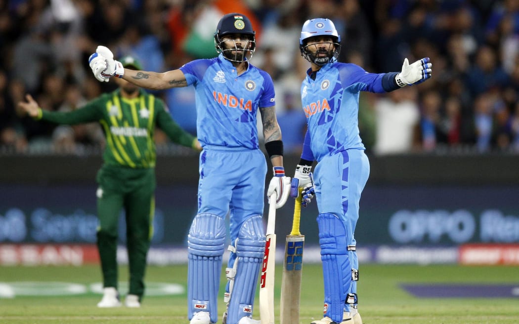 India's Virat Kohli and Dinesh Karthik playing Pakistan at the MCG during the 2022 T20 World Cup.