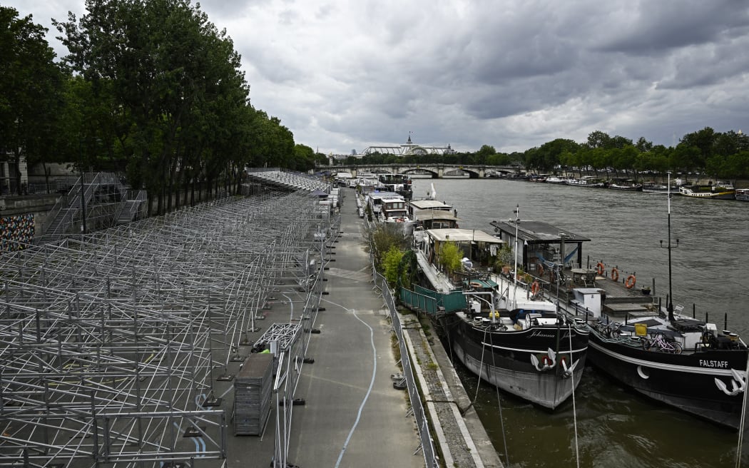 A general view shows stands under construction along the banks of the Seine River ahead of the Paris 2024 Olympics.