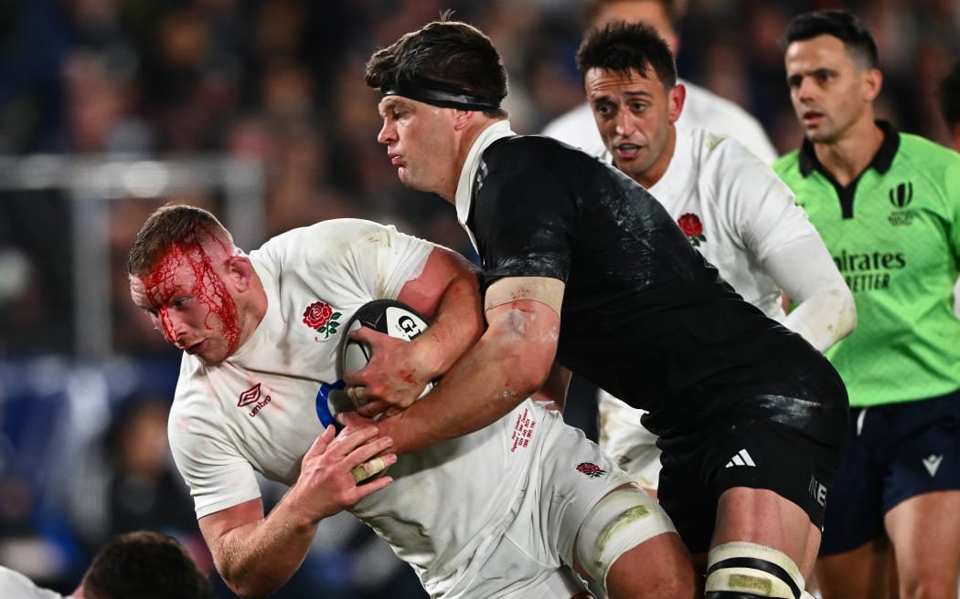 England Sam Underhill is tackled by New Zealand Scott Barrett, New Zealand All Blacks v England, 2nd Rugby Union Test Match. Eden Park.
