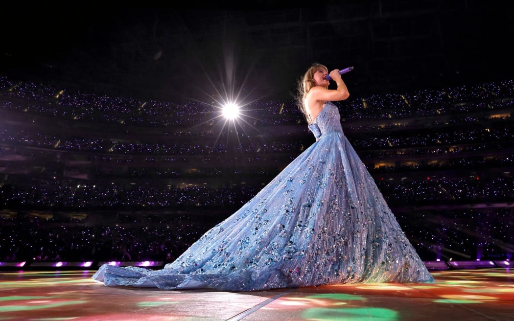 Taylor Swift on stage in the concert movie Taylor Swift: The Eras Tour