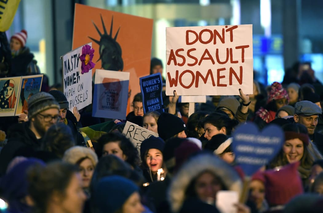 People gather for 'Lights for Rights', the Brussels Women's march, in Brussels, at the same time as the inauguration of US President Donald Trump.
