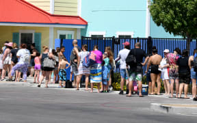 Guests line up to get into Cowabunga Bay Water Park, which was allowed to open for the first time this weekend because of the coronavirus pandemic