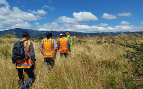 Iwi representatives on their way to the site of a human jawbone discovered in Nelson's Waimea Inlet.