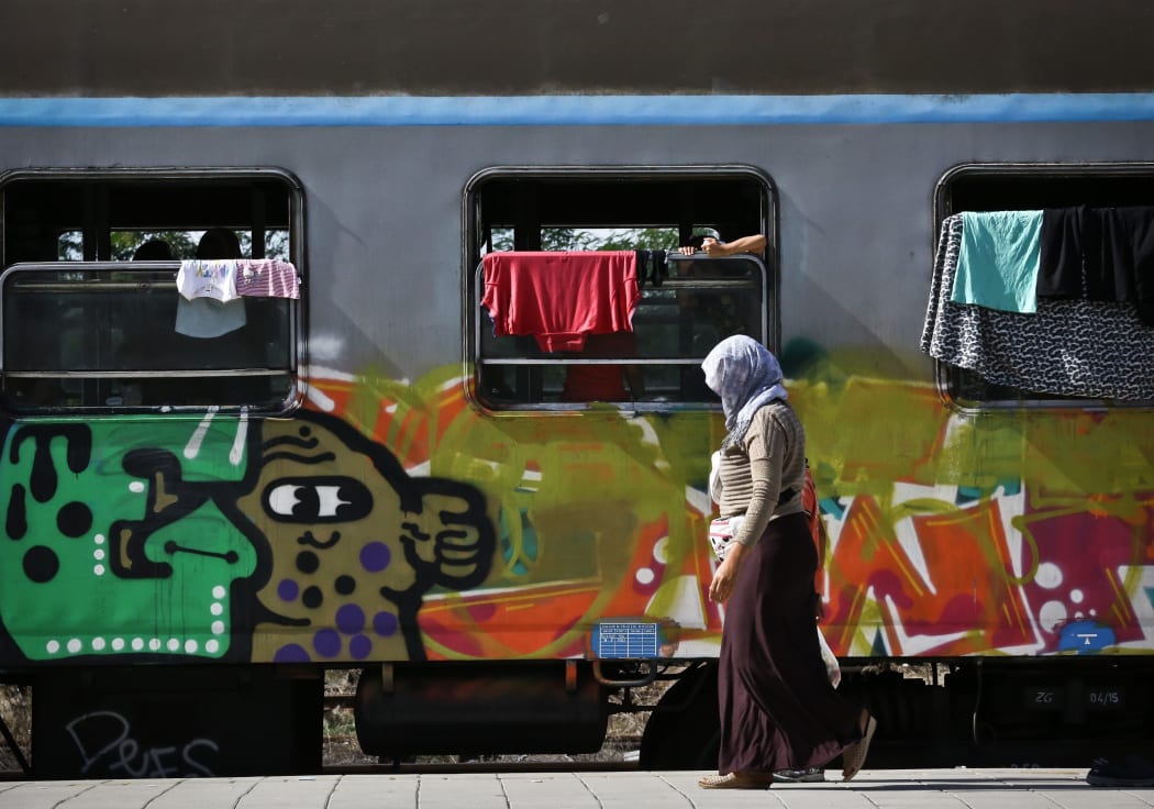 Refugees wait to be transported between Croatia and Hungary, hoping to reach western Europe.