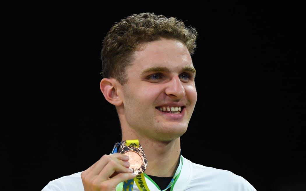 Bronze medallist New Zealand's Lewis Clareburt poses during the medal presentation ceremony for the men's 200m individual medley swimming final at the Sandwell Aquatics Centre, on day six of the Commonwealth Games in Birmingham, central England, on 3 August, 2022.