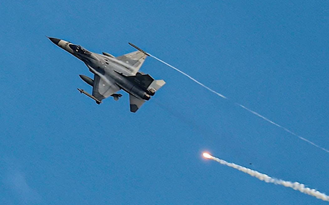 Taiwanese IDF fighter jet fires flares while maneuvering  during the 2-day live-fire drill, amid intensifying threats military from China, in Pingtung county, Taiwan, 7 September 2022. Taipei has been receiving more arms sales and weapons from the US, while fostering its ties with countries like Japan, the UK, Canada and India, as Beijing vows to unify Taiwan without excluding the possibility of using force. (Photo by Ceng Shou Yi/NurPhoto) (Photo by Ceng Shou Yi / NurPhoto / NurPhoto via AFP)