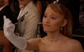 Ariana Grande reaches out to Golden Globes host Nikki Glaser who referenced the "holding space" meme that went viral during the Wicked press tour.