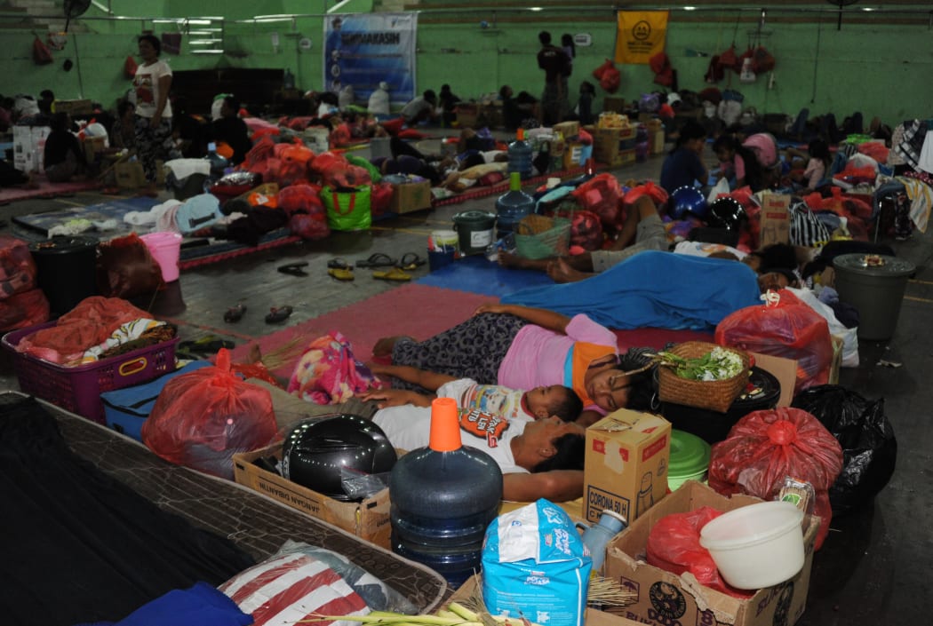 Balinese stay the night at an evacuation centre after Mt Agung volcano erupted for a second time within a week, at the Klungkung Regency on Saturday.