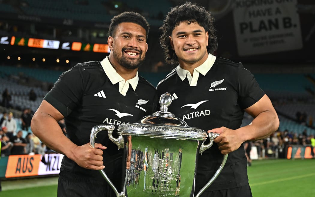 Ardie Savea and Wallace Sititi of the All Blacks with the Bledisloe Cup.