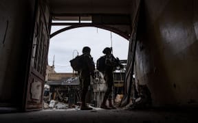 This handout picture released by the Israeli army on February 29, 2024 shows Israeli army soldiers in an unspecified location in the Gaza Strip amid ongoing battles between Israel and the Palestinian militant group Hamas. (Photo by Israeli Army / AFP) / === RESTRICTED TO EDITORIAL USE - MANDATORY CREDIT "AFP PHOTO / Handout / Israeli Army' - NO MARKETING NO ADVERTISING CAMPAIGNS - DISTRIBUTED AS A SERVICE TO CLIENTS ==