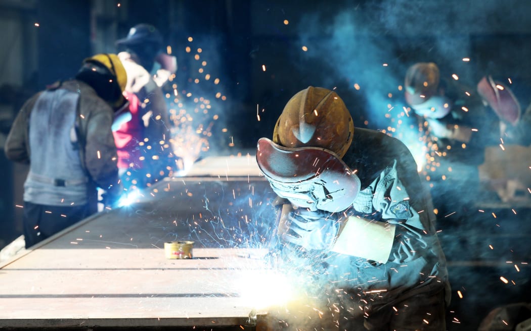 A worker cuts steel at a factory in Huaibei in China's eastern Anhui province.