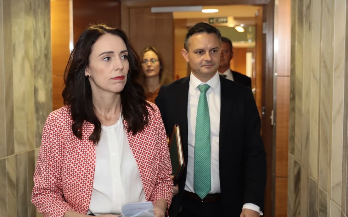 Jacinda Ardern and James Shaw on their way to unveil the zero carbon bill.