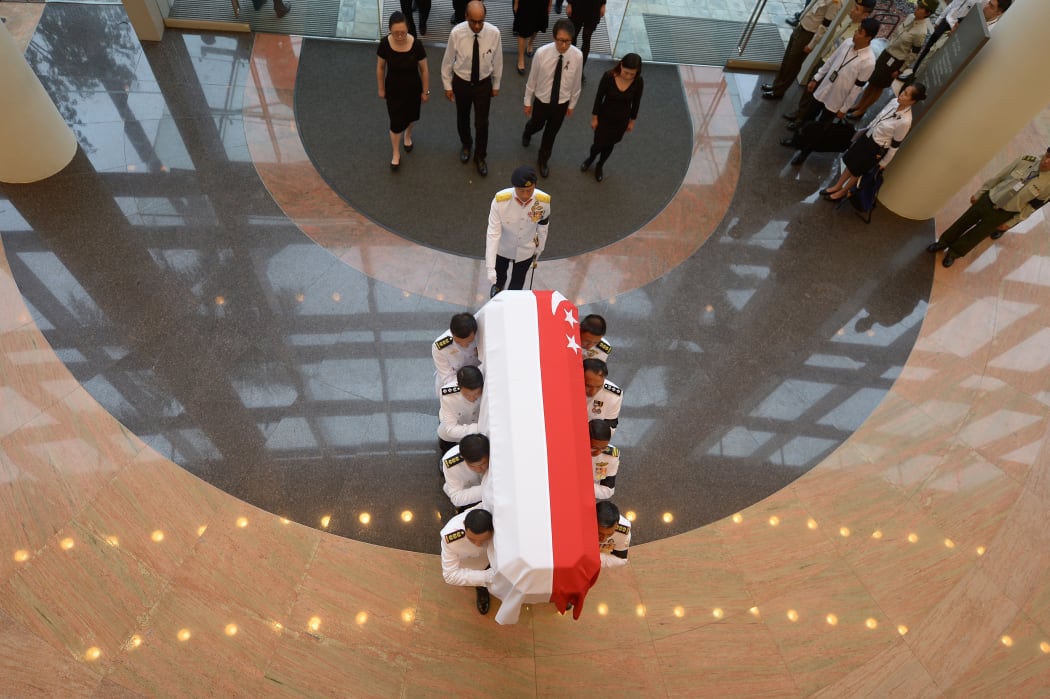 The coffin carrying Lee Kuan Yew's body is transferred from Parliament House for his funeral procession.