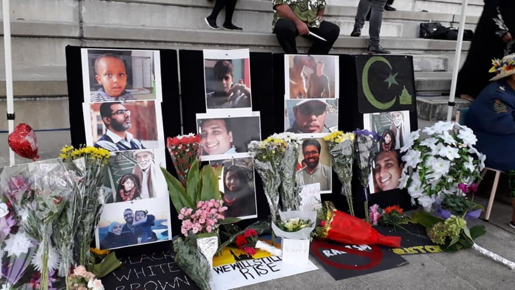 Floral tributes surround photographs of some of the victims of the Christchurch terror atttacks during the combined peace vigil attended by Auckland mayor Phil Goff at the Centre Park Stadium in Mangere on Tuesday.