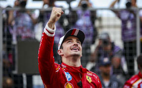 Charles Leclerc celebrates winning the 2024 Monaco GP.