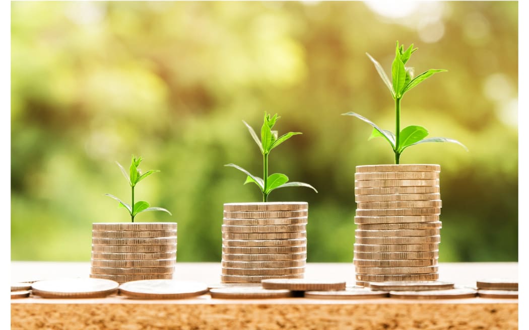 Coins with plants sprouting from them