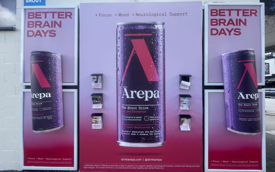 Three large street posters selling the drink Ārepa, with bright pink images of the canned drink. At the top of the poster, the ad says "+ FOCUS + MOOD + NEUROLOGICAL SUPPORT"