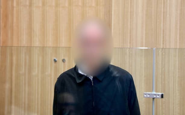 An officer appears in the Manukau District Court on 11 charges of possessing objectionable material.