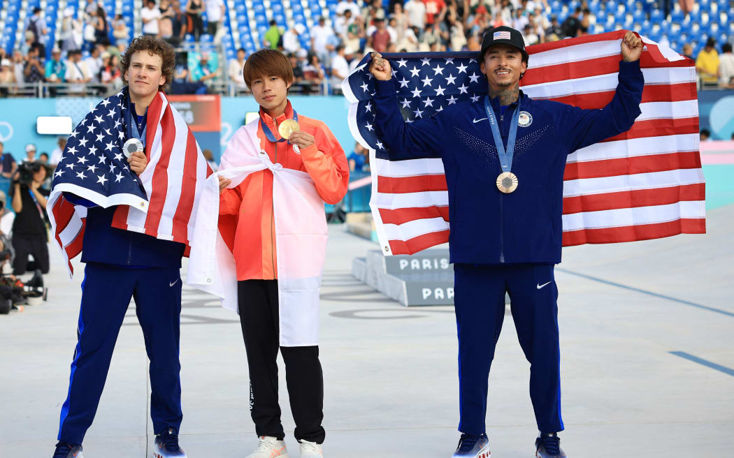 (L-R) Easton Jagger of the U.S., silver, Horigome Yuto of Japan , gold, and Huston Nyjah of the U.S., bronze, pose after their street skateboarding medal presentation at the Paris Olympics.