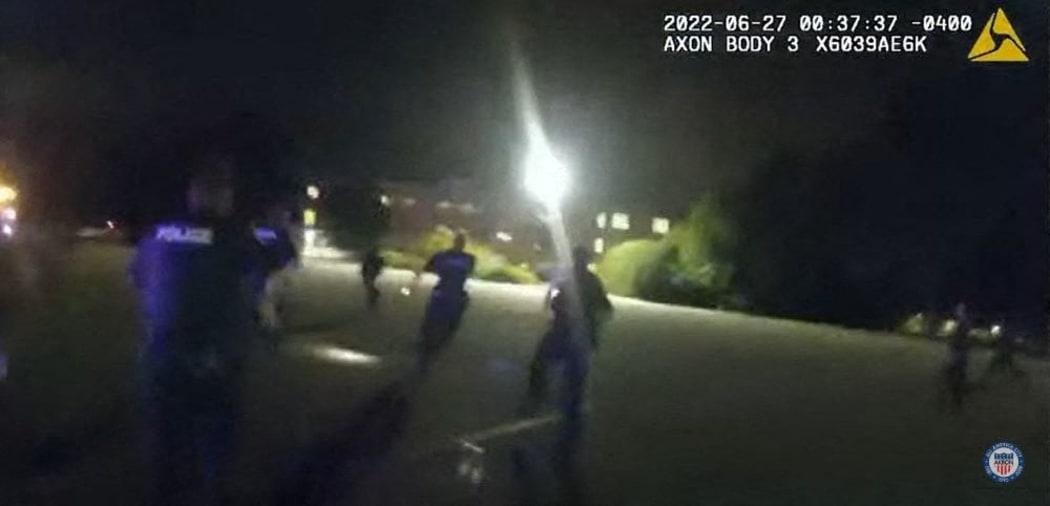 This image captured from a police officer's body camera and provided by the Akron Police Department on July 3, 2022, shows police pursuing 25-year-old Jayland Walker on foot during a traffic stop in Akron, Ohio, on 27 June, 2022.