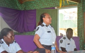Deputy Commissioner Juanita Matanga 
talks to members of the Kariki community