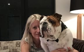 Natalie Newton, of Milford, Auckland, and 2-year-old bulldog Tank.