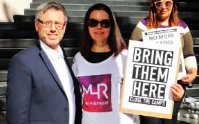 George Newhouse with refugee advocates at the Australian vigil for Hamed Shamshiripour.