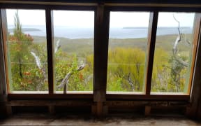 View of Port Ross from the window of the Coastwatcher's lookout at Ranui Cove