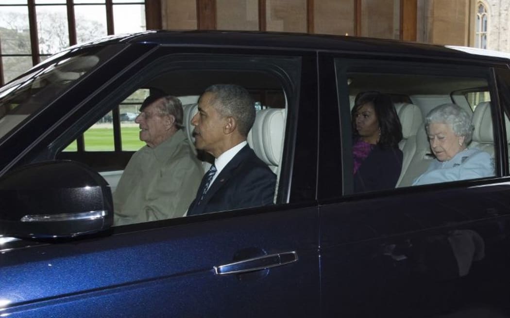 Britain's Prince Philip, Duke of Edinburgh drives former US President Barack Obama, US First Lady Michelle Obama and Queen Elizabeth II in Windsor, southern England.