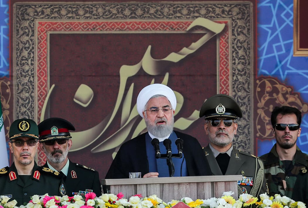 Iranian President Hassan Rouhani  giving a speech during the annual "Sacred Defence Week" military parade today.