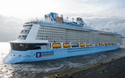 The new cruise ship of the Meyer dockyard in Papenburg, ‘Ovation of the Seas’, arriving in bremerhaven, Germany, 28 March 2016. After the first major test run on the North Sea, the 348 meter long ship will be finalised for the handover to the US-American shipping company ‘Royal Carribean International’. PHOTO: INGO WAGNER/dpa (Photo by INGO WAGNER / DPA / dpa Picture-Alliance via AFP)