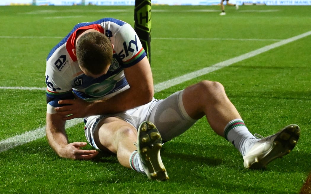 An injured Rocco Berry of the Warriors during the NRL Round 27 match between the Manly Sea Eagles and the New Zealand Warriors.