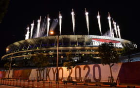 Fireworks go off around the Olympic Stadium during the closing ceremony of the Tokyo 2020 Olympic Games.