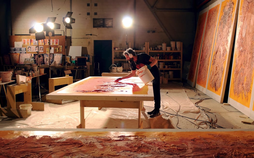 Sandro Kopp completing paintings for The French Dispatch