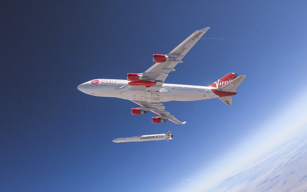 This handout photo obtained May 25, 2020 courtesy of Virgin Orbit shows Cosmic Girl as it releases LauncherOne mid-air for the first time during a July 2019 drop test.