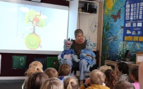 New Zealand author Avril McDonald reading The Wolf and the Hocus Pocus at a Wellington kindergarten.