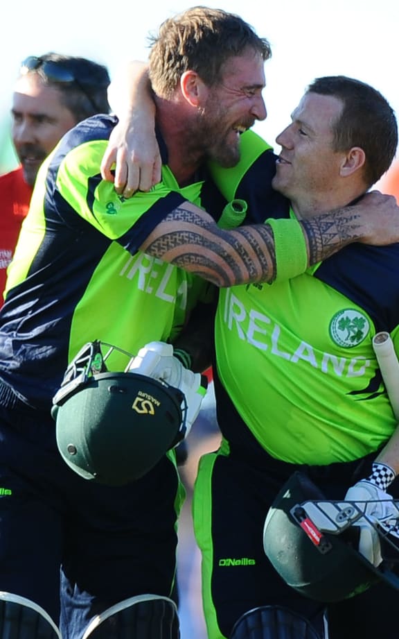 Ireland's John Mooney (left) and Niall O`Brien embrace after winning their Cricket World Cup match over the West Indies, in Nelson.