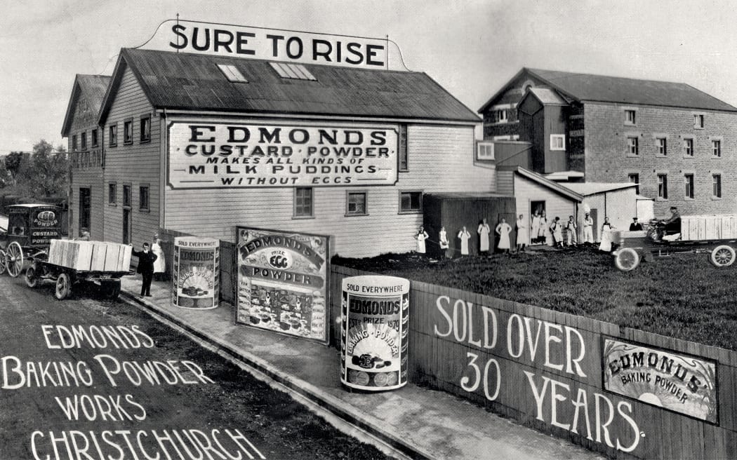 Edmonds factory, 1912. Thomas and Will stand together in front of the factory next to the car.
