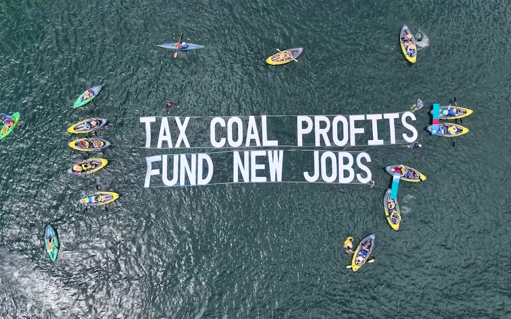 A call to tax coal profits was made by protestors who took to the water in kayaks.