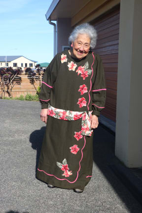 Taesega I E Sidler outside her home