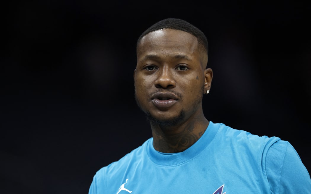 (FILES) Terry Rozier looks on prior to the game against the Oklahoma City Thunder at Spectrum Center on December 29, 2022 in Charlotte, North Carolina. Rozier was arrested on October 23, 2025, as part of a federal investigation into illegal gambling. (Photo by Jared C. Tilton / GETTY IMAGES NORTH AMERICA / AFP)