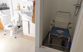There's a huge step to get into the shower for Josh Perry and he says the toilet should be replaced too.
