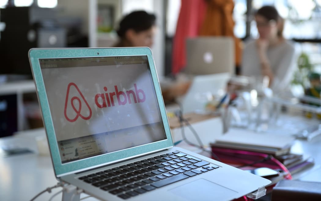 Logo of online home rental website Airbnb displayed on a computer screen in the Airbnb offices in Paris.
