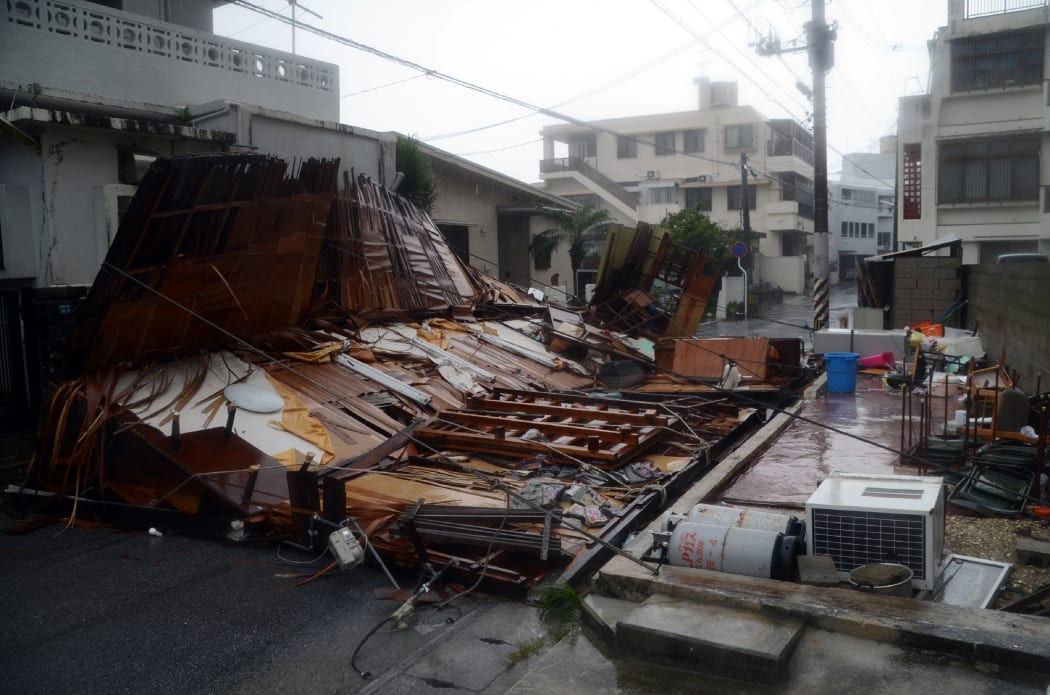 Strong winds caused this house to collapse in Naha on the island of Okinawa.