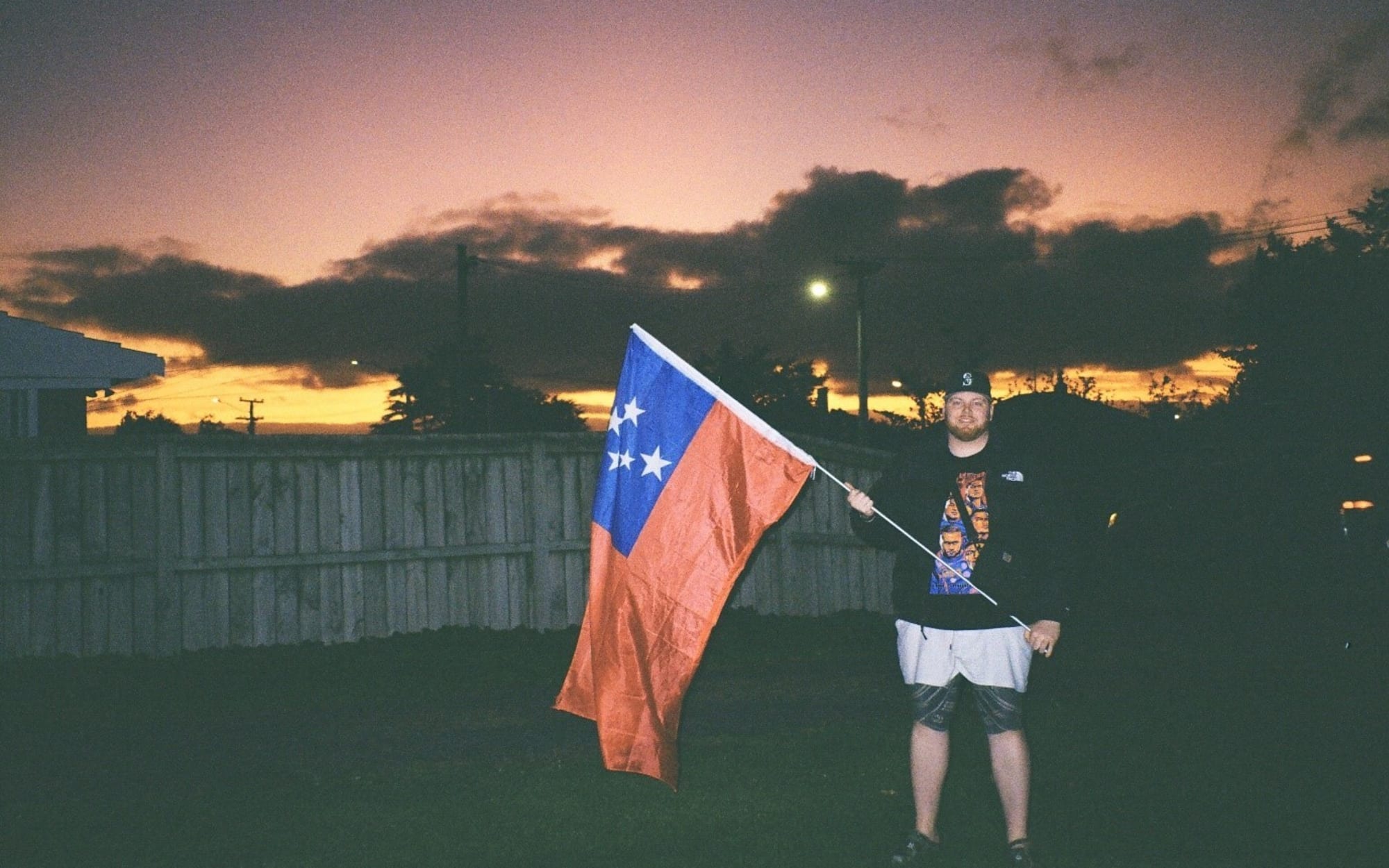 So'omalo Iteni Schwalger with a Samoan flag.